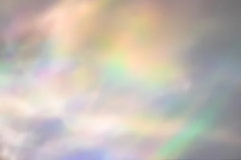Blurred rainbow light refraction texture on white wall Stock Photos