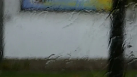 Blurred rainy window - Bus drive - Slow motion Stock Footage 78016485
