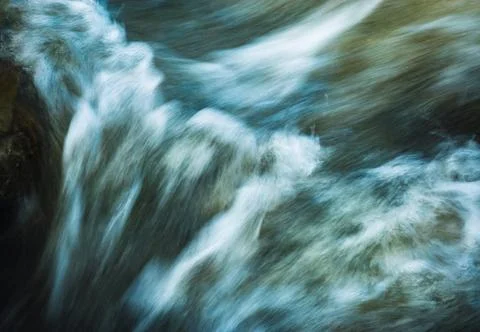 Blurred rapids of the river Stock Photos