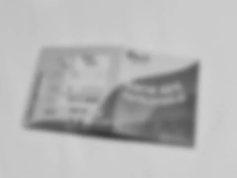 Blurred rectangular object resting on a gray surface, creating an abstract mo 스톡 사진