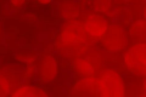 Blurred red bokeh background effect. Hot defocused red lights Stock Photos