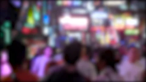 Blurred red light district in Pattaya, bright signboard of nightclubs, Thailand Stock Footage 231052701