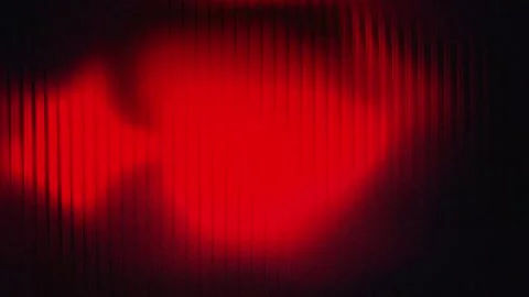 Blurred red neon glow on dark background with grain texture, abstract seamless l Stock Footage 340874518