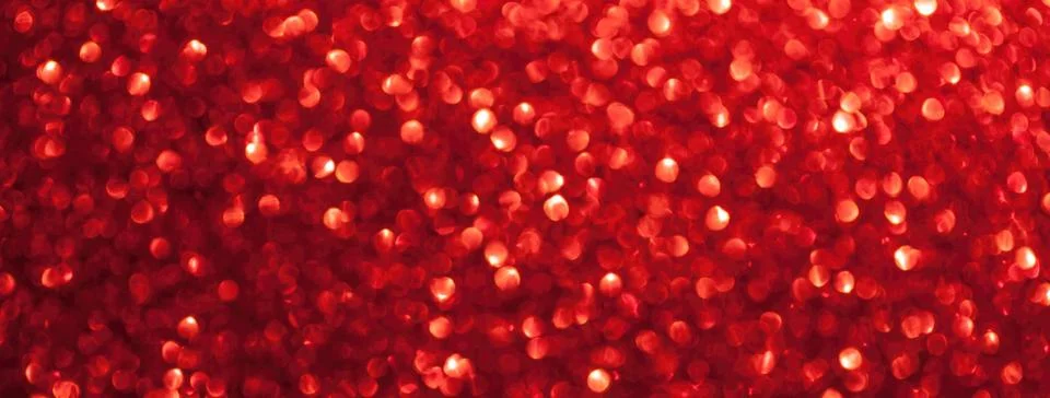 Blurred red sparkling background from sequins, macro. Shiny ruby glittery bok Stock Photos