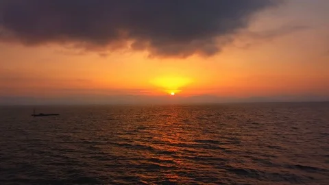 Blurred reflected in the sea sun ray and sunrise over the calm sea. the sun Stock Footage 114666158