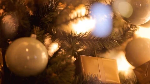 Blurred reflection of people walking on the background decorated Christmas tree. Stock Footage 69925053