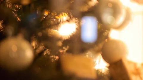 Blurred reflection of people walking on the background decorated Christmas tree. Stock Footage 69950957