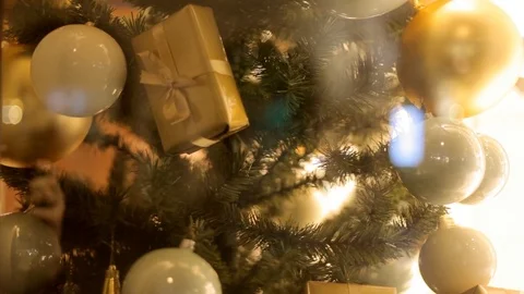Blurred reflection of people walking on the background decorated Christmas tree. Video stock 69951152