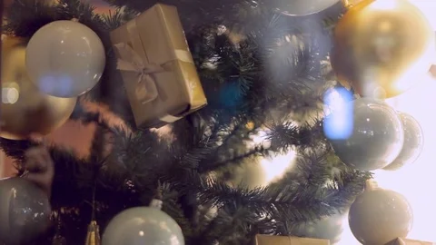 Blurred reflection of people walking on the background decorated Christmas tree. Stock Footage 69951531