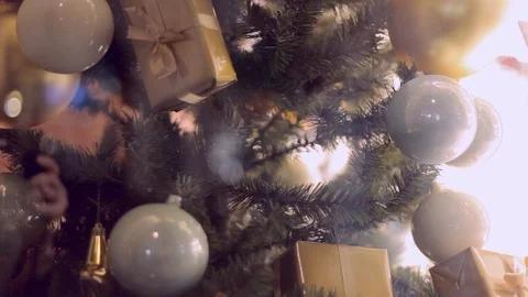 Blurred reflection of people walking on the background decorated Christmas tree. Stock Footage 69951879