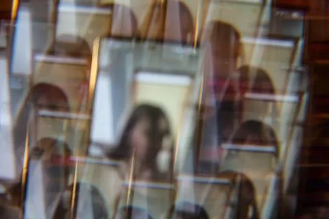 Blurred reflections in framed portraits Stock Photos