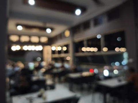 Blurred restaurant interior with tables. Stock Photos