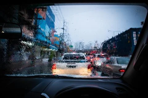 Blurred, Rush hour after work, Cars stuck and traffic jam in the rain Bangkok   Stock Photos