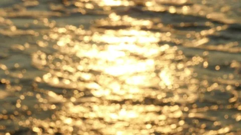 Blurred sea wave background with bokeh at sunset Stock Footage