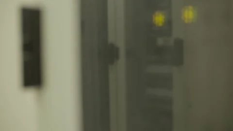 Blurred server room with yellow indicator lights in focus Stock Footage 289201919