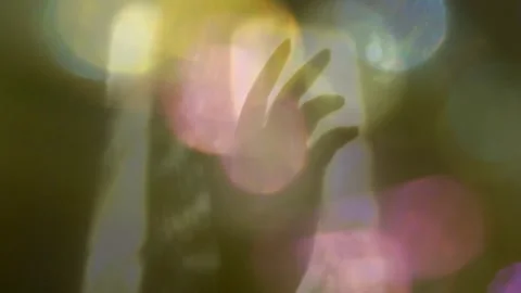 Blurred shadow of female hand on yellow wall background. Stock Footage 240965802