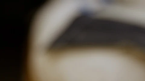 Blurred to sharp closeup shot of suit making process. Basting thread on Stock Footage 127259191