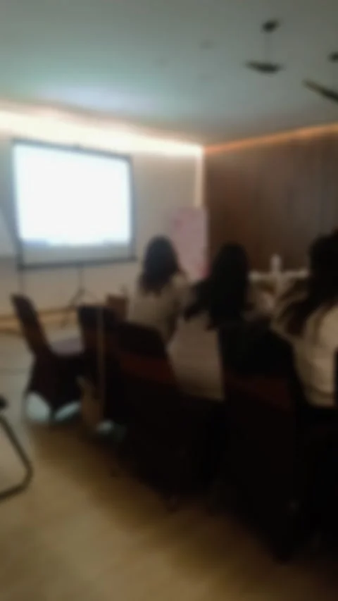 A blurred shoot of people attending a presentation in a modern conference room. Stock Footage 340533784