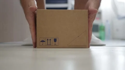 Blurred Shooting with a Man Taking from the Door a Package Delivered. Stock Footage 238936752