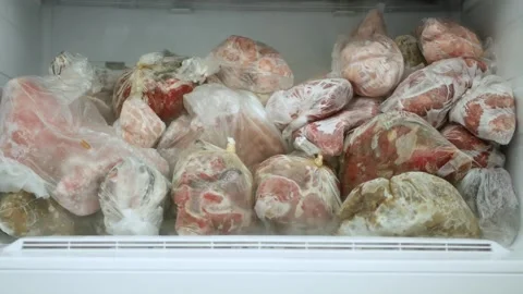Blurred Shooting with an Open Freezer Full with Frozen Meat and Vegetables. Man Stock Footage 300090082