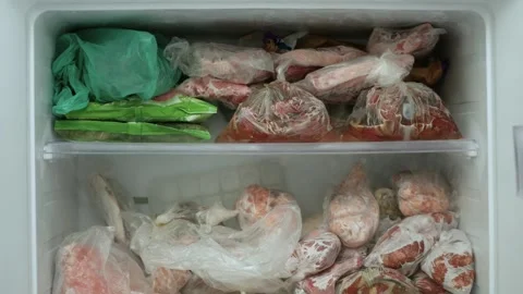 Blurred Shooting with an Open Freezer Full with Frozen Meat and Vegetables. Stock Footage 309438598
