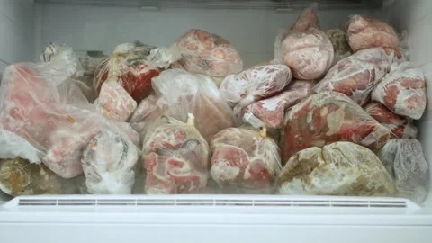Blurred Shooting with an Open Freezer Full with Frozen Meat and Vegetables. Stock Footage 311336994