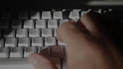 Blurred Shooting with Programmer Hands Writing a Code on Computer Stock Footage 297189018