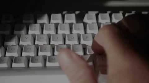 Blurred Shooting with a Programmer Hands Writing a Code on Computer Stock Footage 305399727