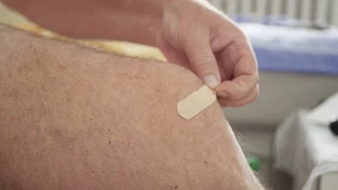 Blurred Shooting with a Suffering Elderly Person with a Patch Applied on a Knee Stock Footage 309436672