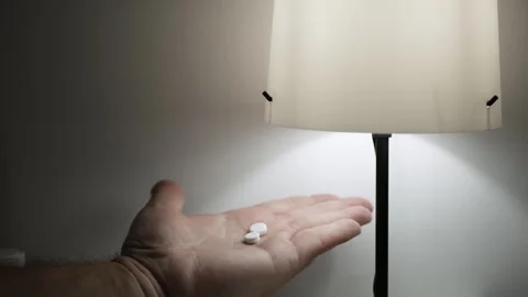 Blurred Shooting with a Suffering Person Taking Medical Pills. Suffering Elderly Stock Footage 336916995