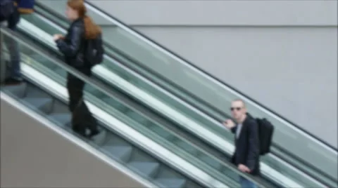 Blurred shoppers using escalator Stock Footage 43562986