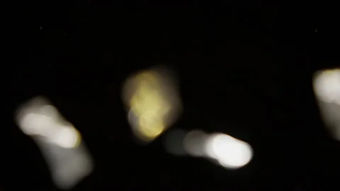 Blurred Shot Of Confetti Exploding On A Black Background Stock Footage 233461547