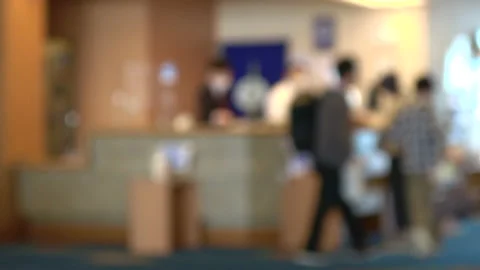 Blurred shot of the guests with mask checking out the hotel in Japan. 4K Stock Footage 146760208