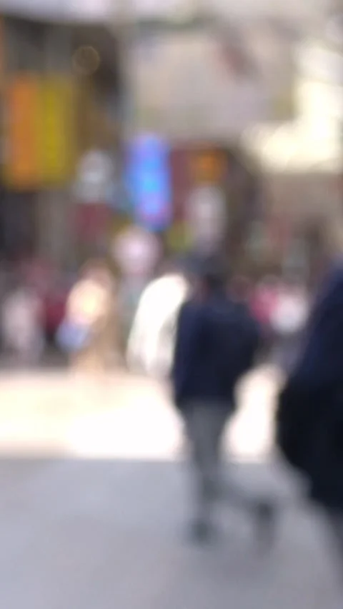 Blurred shot of many people in mask walking on the street of Japan. 4K Stock Footage 344085227
