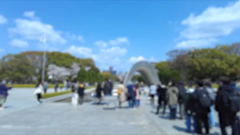 Blurred shot of people doing sightseeing at Hiroshima Peace Memorial Park, Japan Stock Footage 306271888