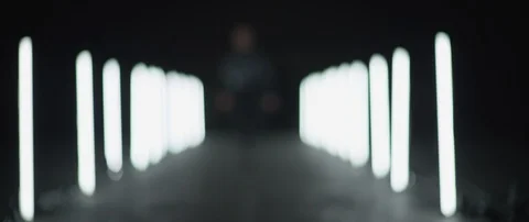 Blurred shot person running between led stick lights in slow motion, Japan Stock Footage 124661774