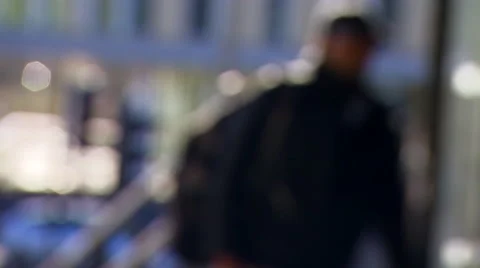 Blurred Shot of a Shopper Walking through Automatic Doors Stock Footage 61483686