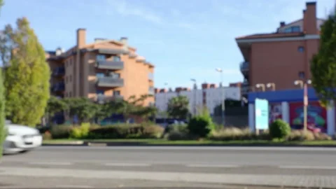 Blurred side view of street and road traffic in small town of Spain Stock Footage 164993698