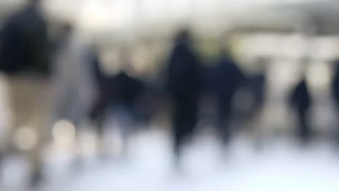 Blurred silhouette of crowd walking through sunlit urban plaza. Stock Footage 333531495
