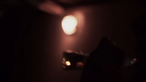 Blurred silhouette guy in hood, jacket drinking alcohol from neck bottle Stock Footage 126352450