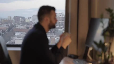 Blurred silhouette of Young Man Freelancer Working Remotely. Stock Footage 194572962