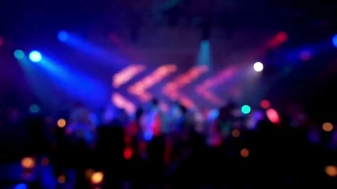 Blurred silhouettes of Crowd making party at a rock concert. dancing party cl Stock Footage 265763379