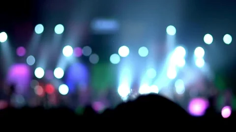 Blurred silhouettes of Crowd making party at a rock concert. dancing party cl Stock Footage 265763456