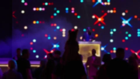 Blurred silhouettes of people dancing at a disco. Stock Footage 327773316
