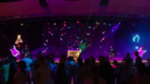 Blurred silhouettes of people dancing at a disco. Stock Footage 327773340