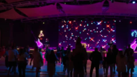 Blurred silhouettes of people dancing at a disco. Stock Footage 327773359