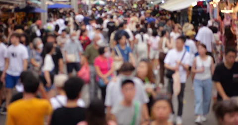 Blurred slow motion shot of crowd of people walking at Chatuchak market 库存影片 326375289