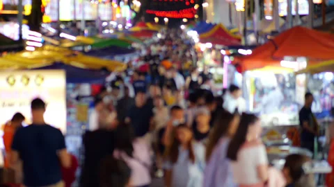 Blurred slowmo shot of crowd walking at Jalan Alor food street in Kuala Lumpur Video stock 319013654