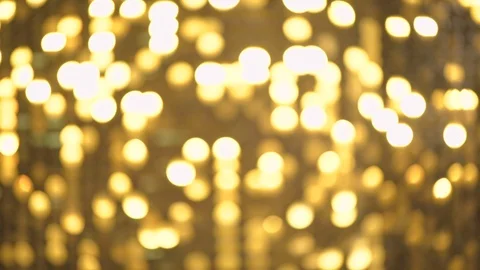 Blurred small metal bokeh background. Glittering golden light dots, Stock Footage 120996359