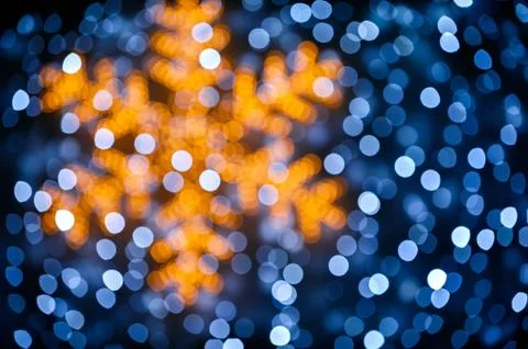 Blurred snowflake and lights background Stock Photos
